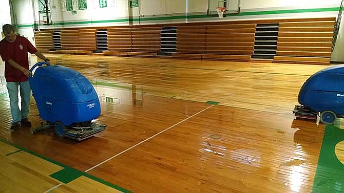 Heavy winds late on Monday night caused significant damage at Blair Oaks High School gymnasium. A portion of the roof was blown off and heavy rains flooded the building, damaging ceiling tiles, computers and the gym's hardwood floor. A crew from Servepro was on the scene drying the gym floor and vacuuming water to avoid mold and mildew.