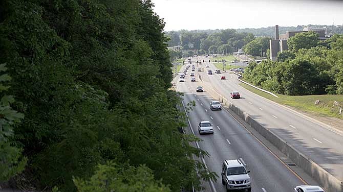 Jefferson City traffic moves along U.S. 50/63, also known as the Whitton Expressway, as seen July 7, 2014, looking to the west from the Jackson Street overpass. The expressway and the overpass are scheduled to be improved as part of a project to construct a new interchange at Lafayette Street.