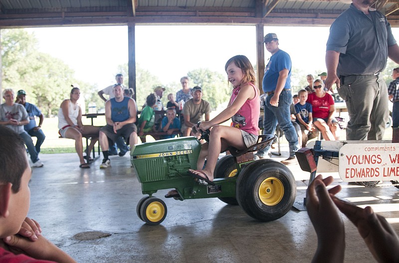 Cally Cothern, 5, of Auxvasse competes in the annual tractor pull at the Callaway County Youth Expo in Auxvasse.