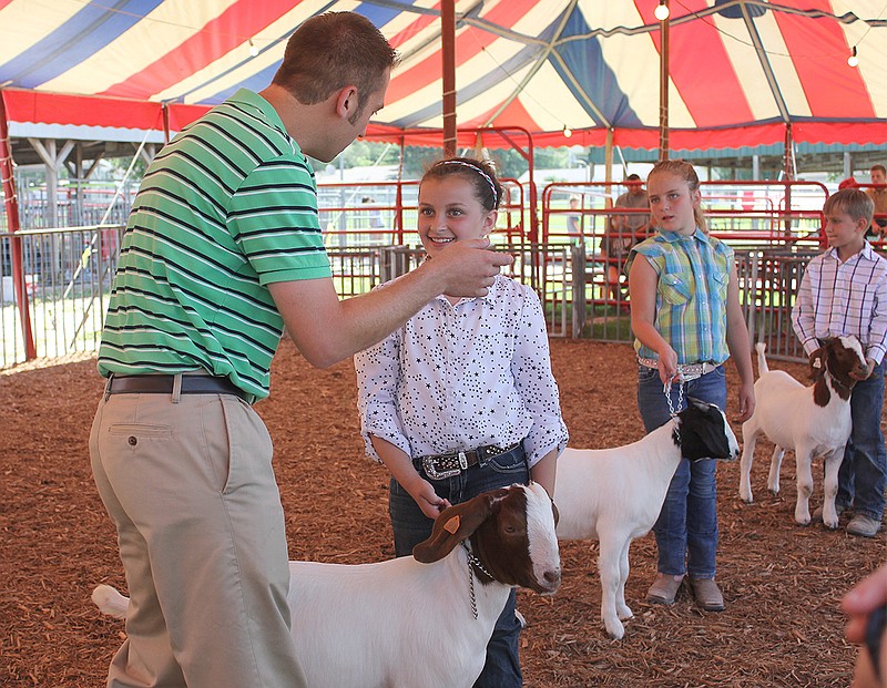 Aylie Haubner of Auxvasse gets some tips from the judge during the junior showmanship class. Haubner ended up winning the junior showmanship award.