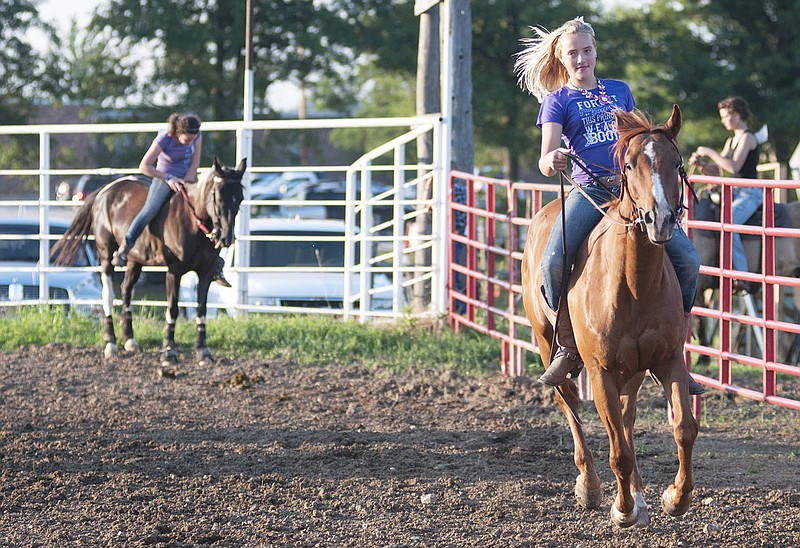 Shea Smith, 12, of Hatton rides Pumpkin in the buck riding competition Thursday at the 2014 Callaway County Youth Expo. Smith placed first in the contest.