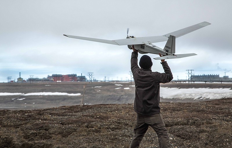 In this photo June 7, 2014, photo released by BP Alaska, Unmanned Aerial System (UAS) technology using an AeroVironment Puma drone is given a pre-flight checkout in preparation for flights by BP at its Prudhoe Bay, Alaska operations. The Federal Aviation Administration granted the first permission for commercial drone flights over land, the latest effort by the agency to show it is loosening restrictions on commercial uses of the unmanned aircraft. The federal effort to provide drones regular access to U.S. skies faces significant hurdles and won't meet a September 2015 deadline set by Congress, said a report released June 30 by a government watchdog. A report by the Transportation Department's inspector general says the Federal Aviation Administration hasn't figured out what kind of technology unmanned aircraft should use to avoid crashing into other planes. 