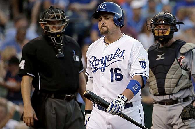Kansas City Royals' Billy Butler walks to the dugout after striking out during the fourth inning of a baseball game against the Detroit Tigers on Friday, July 11, 2014, in Kansas City, Mo.