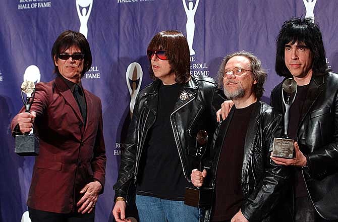 In this March 18, 2002, file photo, members of the Ramones, from left to right, Dee Dee, Johnny, Tommy and Marky Ramone hold their awards after being inducted at the Rock and Roll Hall of Fame induction ceremony at New York's Waldorf Astoria. A business associate says Tommy, the last surviving member of the original group, has died. Dave Frey, who works for Ramones Productions and Silent Partner Management, confirmed that he died on Friday, July 11, 2014. Ramone was 65. 