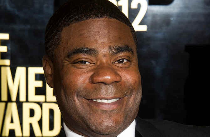  In this April 28, 2012, file photo, Tracy Morgan attends The Comedy Awards in New York. Morgan is suing Wal-Mart over the June 7, 2014, highway crash that seriously injured him and killed a fellow comedian. The lawsuit, filed Thursday, July 10, 2014, in U.S. District Court in New Jersey, claims Wal-Mart was negligent when a driver of one of its tractor-trailers rammed into Morgan's limousine. 