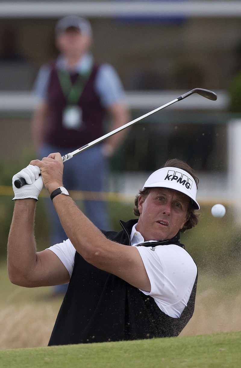 Phil Mickelson plays out of a bunker during a practice round Monday at Royal Liverpool Golf Club, in Hoylake, England.