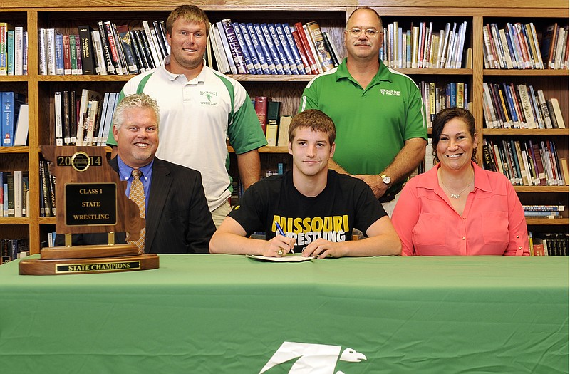 Logan Mudd (seated, center), a 2014 graduate of Blair Oaks High School, has signed a letter of intent to wrestle at the University of Missouri. Also seated are his parents, Paul Mudd and Megan Mudd. Standing (left to right) are Blair Oaks assistant coach Brian Markway and head coach Tim Karsten.