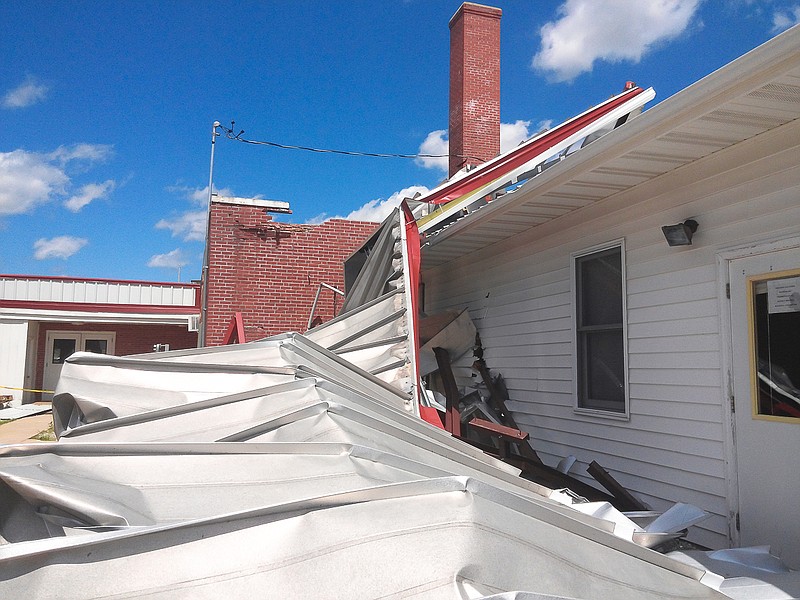 Above is the roof that covered the stage and locker rooms at Prairie Home R-V, now a pile of twisted metal after high winds from the July 7 storm ripped it off. 
