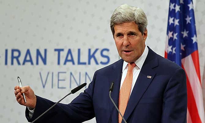 U.S. Secretary of State John Kerry speaking to the media after closed-door nuclear talks on Iran in Vienna, Austria, Tuesday, July 15, 2014. Intense negotiations with Iran have yielded "tangible progress," U.S. Secretary of State John Kerry said Tuesday, but significant gaps remain ahead of a July 20 target date for a deal meant to put firm curbs on Tehran's nuclear activities in exchange for an end to sanctions.