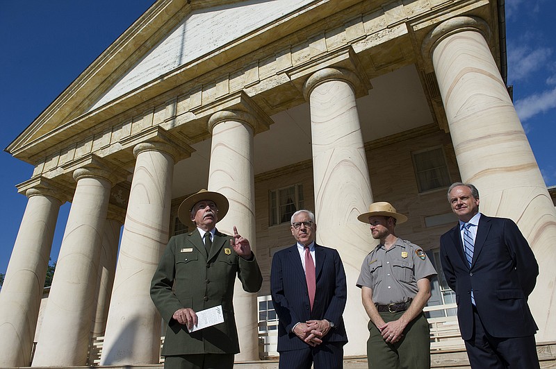 From left, National Park Service Director Jonathan Jarvis speaks as he is joined by philanthropist David Rubenstein, Park Ranger Brandon Bies, and National Park Foundation President and CEO Neil Mulholland, during a Thursday news conference at the Arlington House at Arlington National Cemetery in Arlington, Virginia.