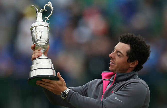 Rory McIlroy of Northern Ireland holds up the Claret Jug trophy after winning the British Open Golf championship at the Royal Liverpool golf club, Hoylake, England, Sunday July 20, 2014.