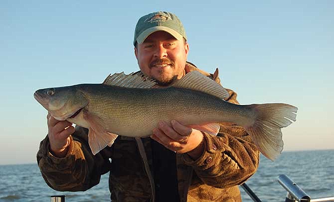 Walleye like this 9-pounder held by Brandon Butler are fairly common when fishing at Lake Erie.