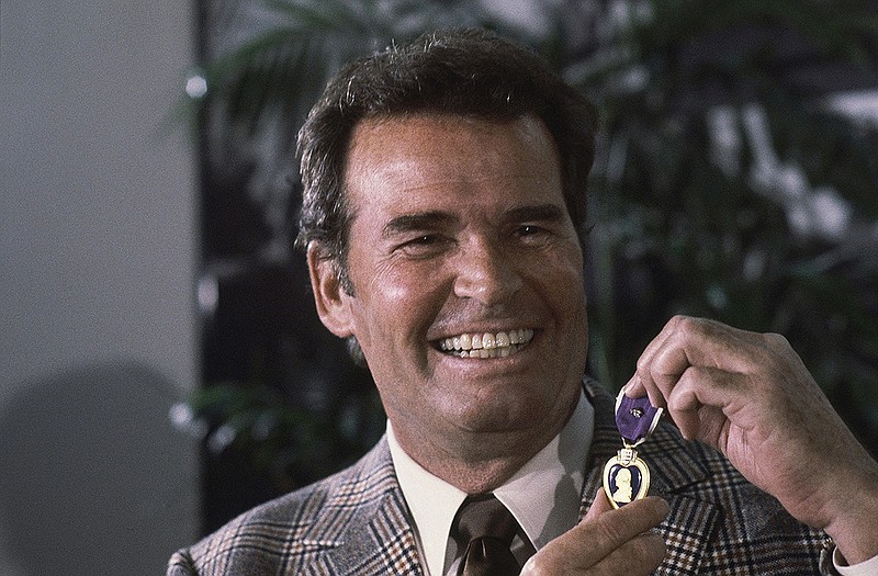 James Garner smiles at a 1983 ceremony where he was awarded two Purple Hearts for wounds suffered in the Korean War. The popular actor died over the weekend of natural causes.