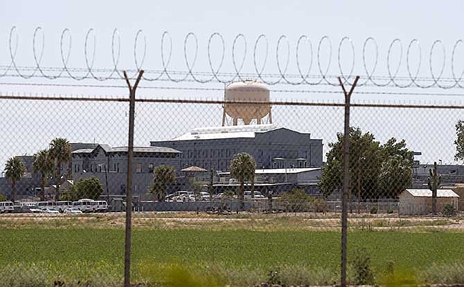 A fence surrounds the state prison in Florence, Ariz. where Joseph Rudolph Wood was executed Wednesday, July 23, 2014.