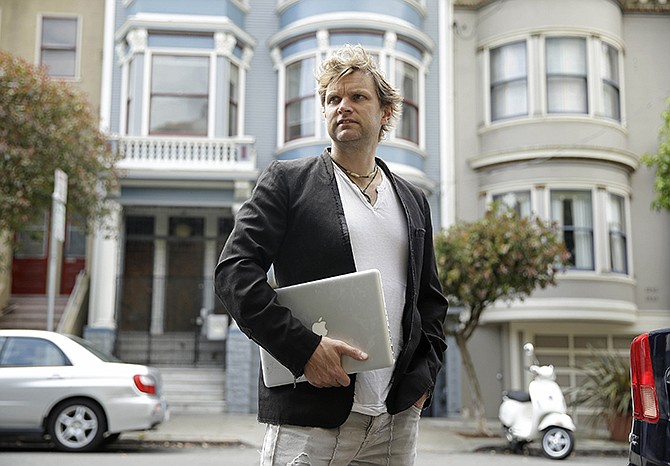 Gerry Kelly, founder of clothing brand Sonas Denim and a Bubblews user, poses near his home in San Francisco. Kelly has already earned nearly $100 from Bubblews since he began using a test version in January. His Bubblews feed serves as a journal about the lessons he has learned in life, as well as a forum for his clothing brand. 