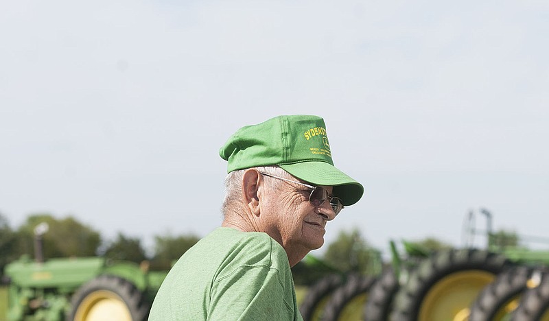 Harold Lehman, 77, answers questions from a Fulton Sun reporter Thursday outside his Mokane home where his 15 restored antique tractors sit. He has two more on deck, and out of them all his favorite is a 1953 John Deere 50 he purchased two years ago.