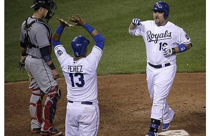 Kansas City Royals' Billy Butler (16) celebrates with Salvador Perez after hitting a two-run home run during the eighth inning of a baseball game against the Cleveland Indians, Friday, July 25, 2014, in Kansas City, Mo.
