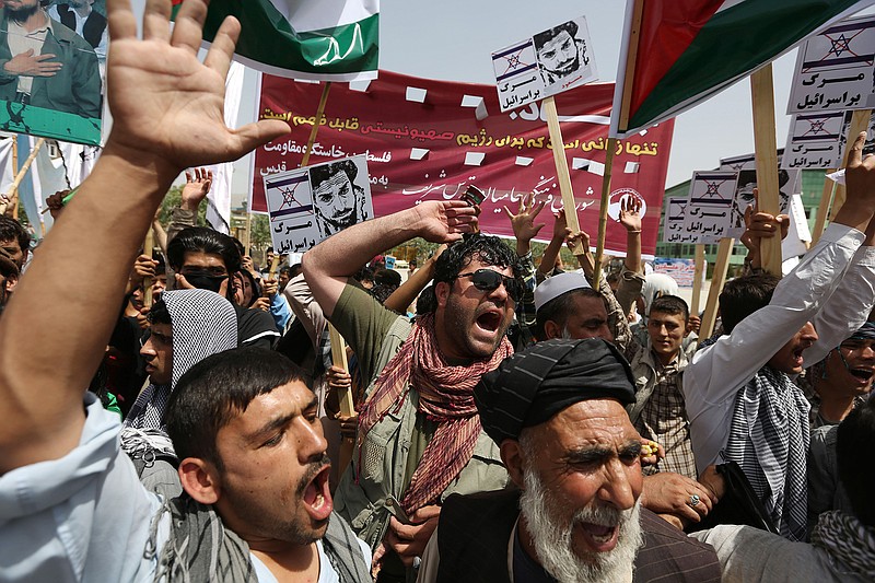 Afghan demonstrators shout slogans against Israel during a rally marking Al-Quds (Jerusalem) Day in Kabul, Afghanistan, Friday. Hundreds of demonstrators took to the streets of Kabul to mark Al-Quds Day, the last Friday of the Islamic holy month of Ramadan, shouting their support for the Palestinian people and highlighting the importance of the city of Jerusalem to Muslims.