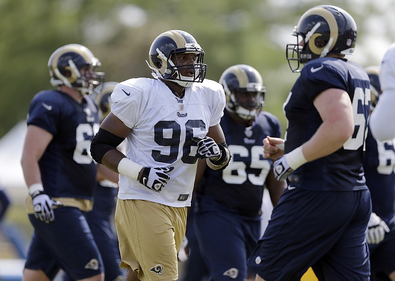 Michael Sam (96) jogs toward the next drill during Tuesday's action at the Rams training camp in St. Louis.