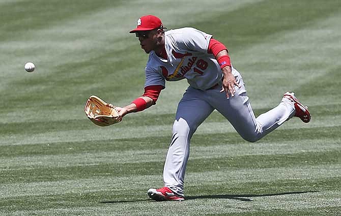 St. Louis Cardinals right fielder Oscar Taveras makes the running catch to take a hit away from San Diego Padres' Rene Rivera in the second inning of a baseball game Thursday, July 31, 2014, in San Diego. 