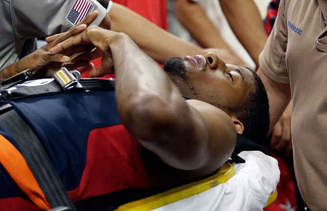 Indiana Pacers' Paul George is taken off the court after he was injured during the USA Basketball Showcase game Friday, Aug. 1, 2014, in Las Vegas.