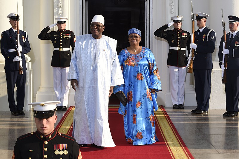 Ibrahim Boubacar Keita, President of the Republic of Mali and his wife Keita Aminata Maiga arrive for a dinner hosted by President Barack Obama for the U.S. Africa Leaders Summit, Tuesday. African heads of state are gathering in Washington for an unprecedented summit to promote business development.