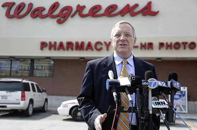 U.S. Sen. Dick Durbin, D-Ill. speaks during a news conference outside a Walgreen's drugstore Wednesday, Aug. 6, 2014, in Chicago. Durbin praised Walgreen, the nation's largest drugstore chain, for declining to pursue an overseas reorganization to trim its U.S. taxes.