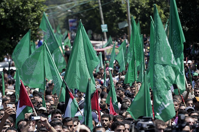 Palestinian Hamas supporters gather for a rally in Gaza City, Gaza Strip, Thursday. The rally drew several thousand supporters and a senior Hamas official has told supporters at the rally that the war with Israel won't be over until the group's political demands are met. Israel and Hamas were holding indirect negotiations in Cairo, Egypt about new border arrangements for blockaded Gaza and extending a cease-fire.
