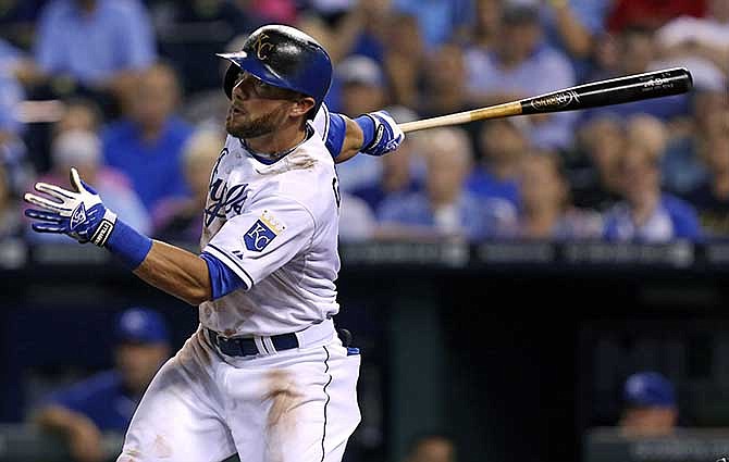 Kansas City Royals' Alex Gordon hits an RBI single in the sixth inning during a baseball game against the San Francisco Giants, Friday, Aug. 8, 2014, in Kansas City, Mo. 