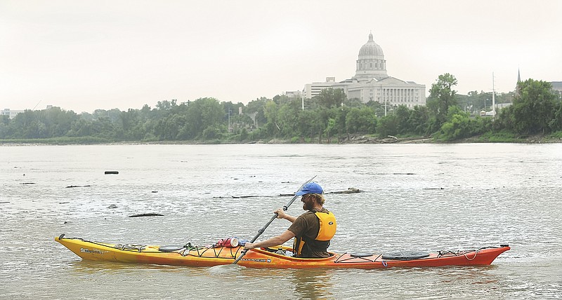 Brian Duncan shoves off the bank as he continues his journey down the Missouri River on his way home to Chamois for a couple of days. He stayed in Jefferson City overnight and returned to his paddle Friday afternoon. He started this journey in Three Forks, Montana on May 16 and is taking his time, enjoying the scenery, wildlife and people he sees and meets along his leisurely travels.