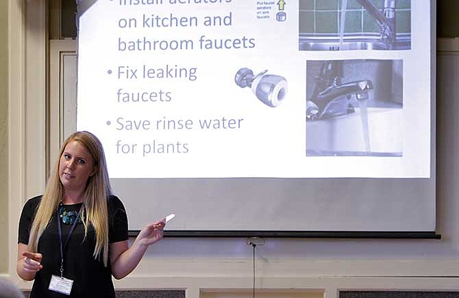 Amanda Bunte, a representative with the City of Santa Cruz, goes over water conservation tips during Water School at the Louden Nelson Community Center in Santa Cruz, Calif., on Monday, July 14, 2014. Every Monday night in the drought-stricken beach town of Santa Cruz, dozens of residents who violated their strict rations take a seat at Water School, hoping to get hundreds of thousands of dollars in distressing penalties waived. 