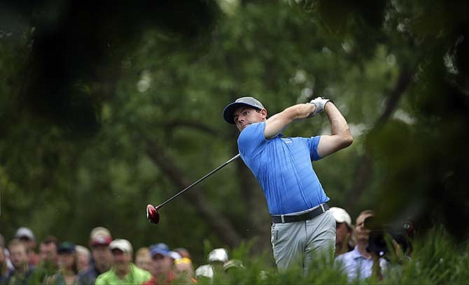 Rory McIlroy, of Northern Ireland, watches his tee shot on the 18th hole during the third round of the PGA Championship golf tournament at Valhalla Golf Club on Saturday, Aug. 9, 2014, in Louisville, Ky. 