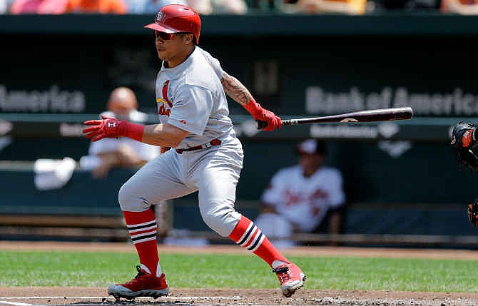 St. Louis Cardinals' Kolten Wong singles in the first inning of an interleague baseball game against the Baltimore Orioles, Sunday, Aug. 10, 2014, in Baltimore. 