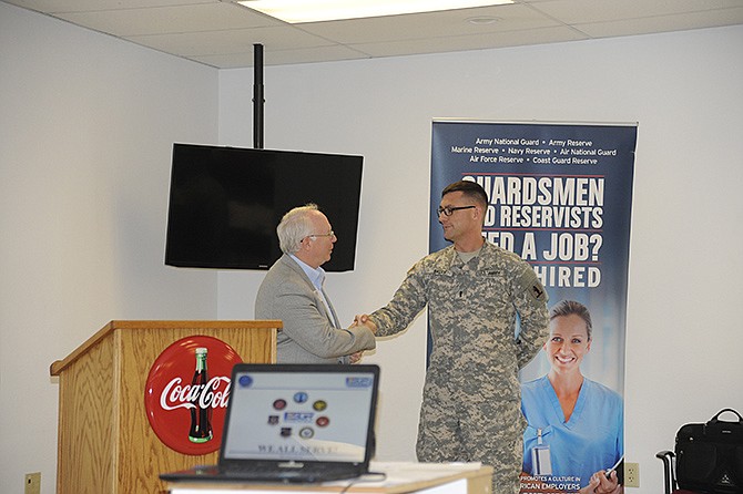 Lee Metcalf, state chairman of the Employer Support of the Guard and Reserve, introduced Jon Barry, director of Show-Me Heroes, at a Lunch With the Boss luncheon Wednesday, where more than 50 community leaders and business owners learned about the value of hiring guardsman and reservists. 