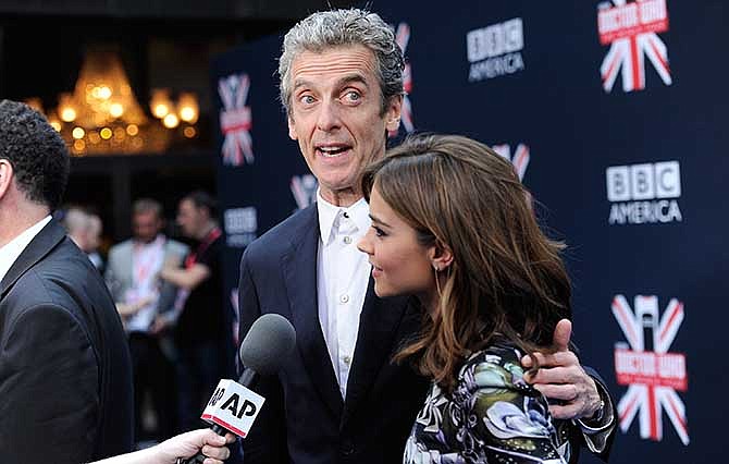 Actors Peter Capaldi and Jenna Coleman attend the BBC America's "Doctor Who" premiere fan screening at the Ziegfeld Theatre on Thursday, Aug. 14, 2014, in New York.