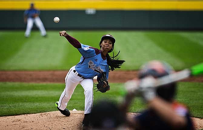 Philadelphia's Mo'ne Davis delivers a pitch against Nashville during her team's 4-0 win in a U.S. pool play baseball game at the Little League World Series, Friday, Aug. 15, 2014, in South Williamsport, Pa.