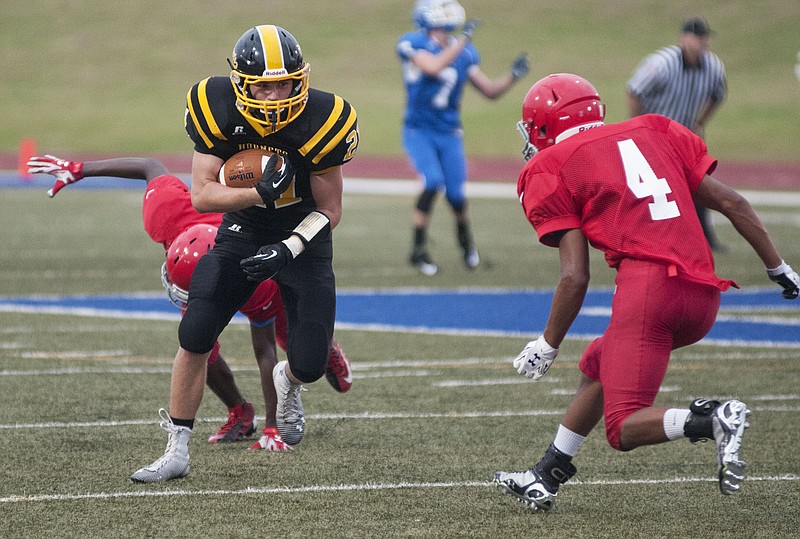 Senior fullback Noah Braun looks ahead after running past a Van Horn High School player Friday during a jamboree game at Boonville High School. 