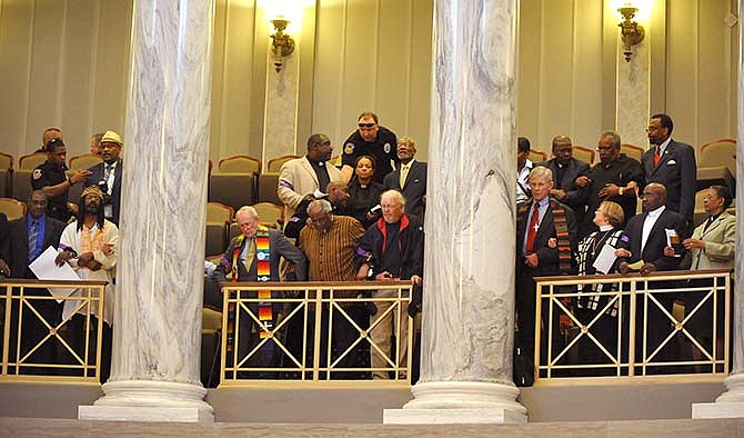 Clergy members rally inside the Missouri Capitol to promote Medicaid expansion on May 6, 2014. Twenty-three of them were charged with obstructing government operations and first-degree trespassing on Aug. 15.