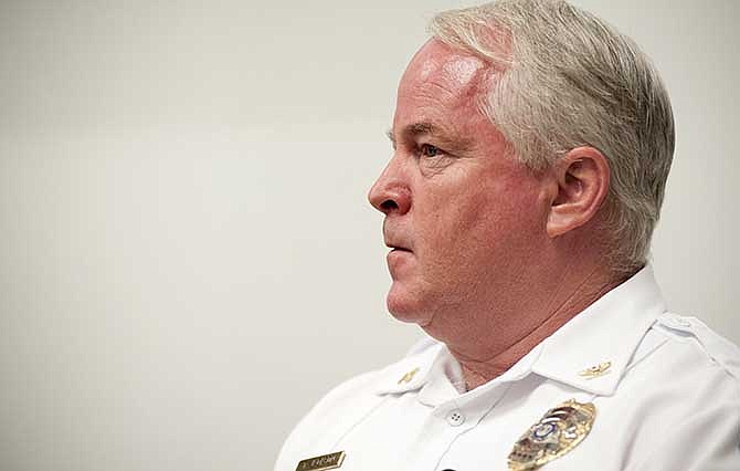 Ferguson Police Chief Thomas Jackson listens Sunday, Aug. 10, 2014, during a news conference addressing issues surrounding the fatal shooting of Michael Brown, 18, by Ferguson police the day before.