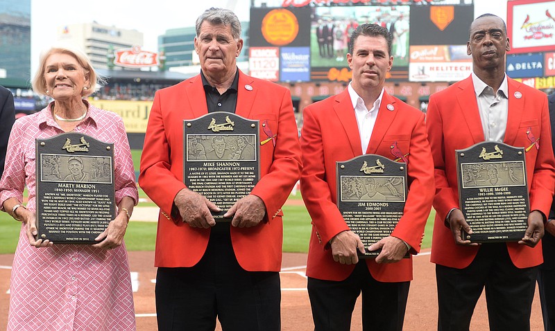 St. Louis Cardinals Hall of Fame inductees or their representatives (from left) Martina Dill, representing her father, Marty Marion, Mike Shannon, Jim Edmonds and Willie McGee are introduced prior to Saturday night's game against the Padres at Busch Stadium.