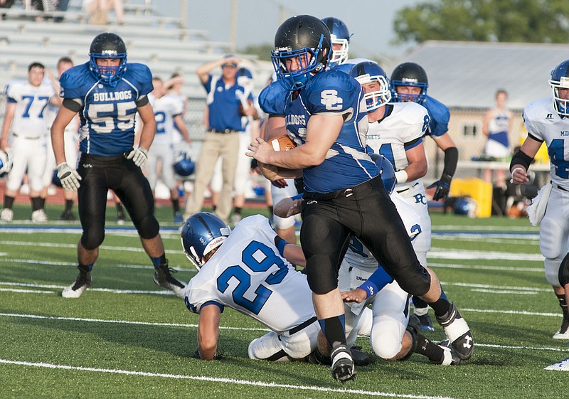 South Callaway senior fullback Dakoda Ballard scores on a 10-yard touchdown run in the first quarter of the Bulldogs' 55-6 season-opening win over Putnam County on Friday night in Mokane. 