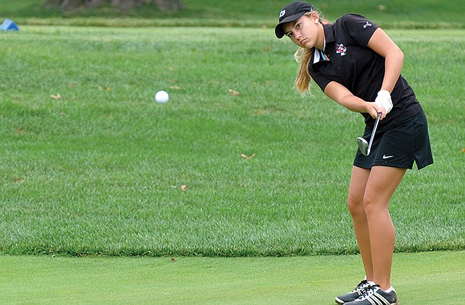 Brooke Thompson of Jefferson City hits a chip shot during last year's Capital City Invitational at Jefferson City Country Club. 