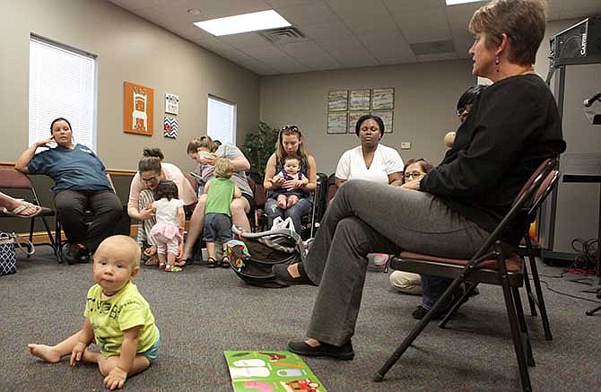 Members of the Cole County Breast Feeding Support Group talk during their meeting Thursday, Aug. 14 at the First Assembly of God church in Jefferson City.  The group had about ten mothers there with their children.  Their next meeting will be at the Capital Mall play place on Aug. 28 for the Breastfeeding Month Celebration.