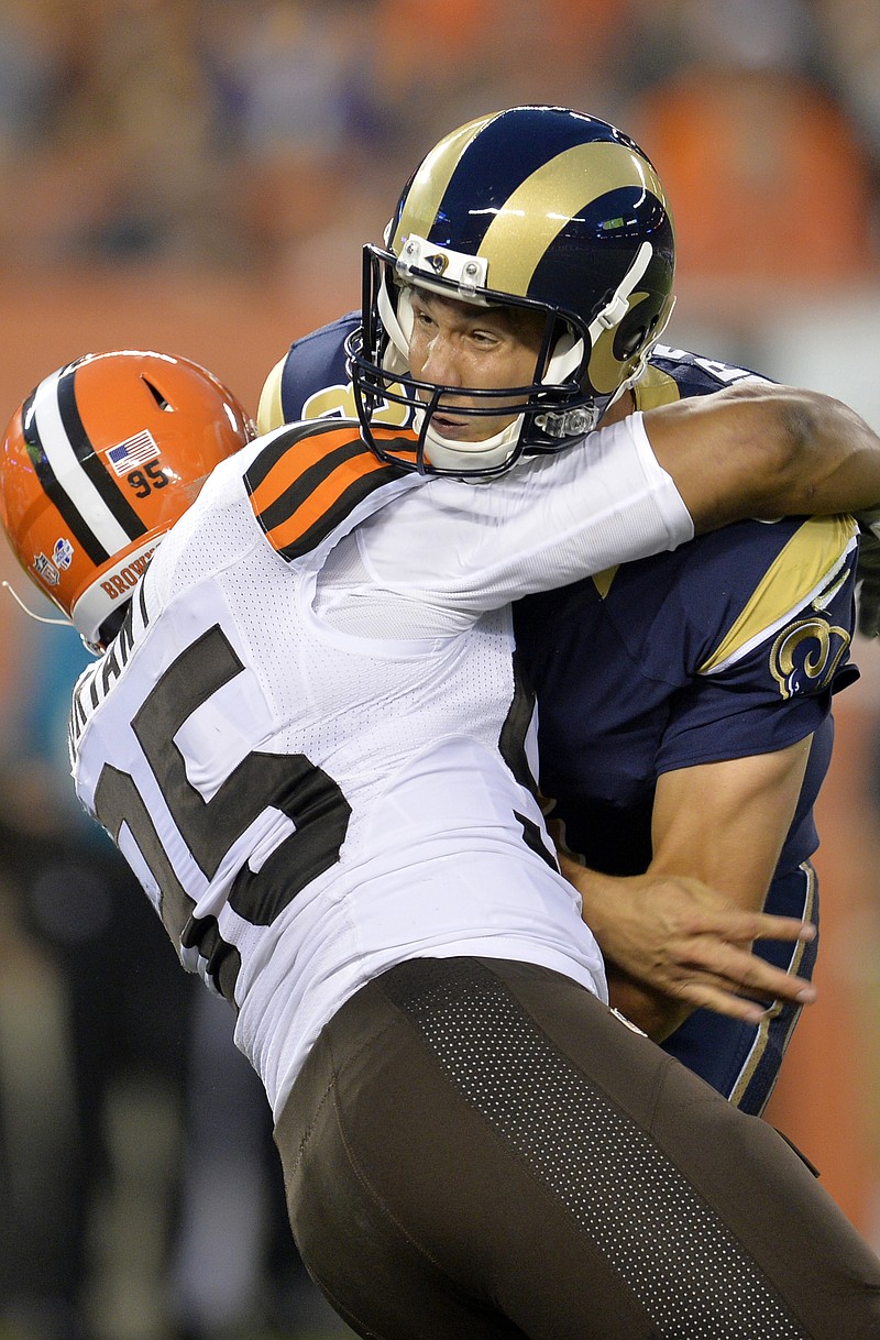 Rams quarterback Sam Bradford gets hit by Browns defensive end Armonty Bryant during the first quarter of Saturday's preseason game in Cleveland. Bradford left the game after the play.