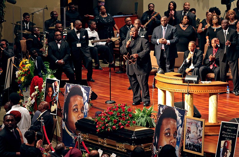 AP
Funeral services for Michael Brown are held on Monday at Friendly Temple Missionary Baptist Church in St. Louis. Thousands of people gathered to say goodbye to Brown, who was shot and killed by a Ferguson police officer on Aug. 9.