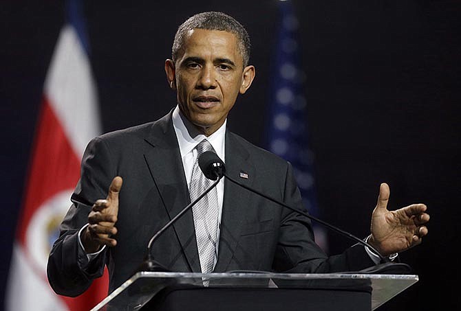 This May 3, 2013 file photo president Barack Obama responding to a question about the situation in Syria during a news conference in San Jose, Costa Rica. One year ago, President Barack Obama was barreling toward airstrikes in Syria when he abruptly announced that he first wanted approval from congressional lawmakers. 