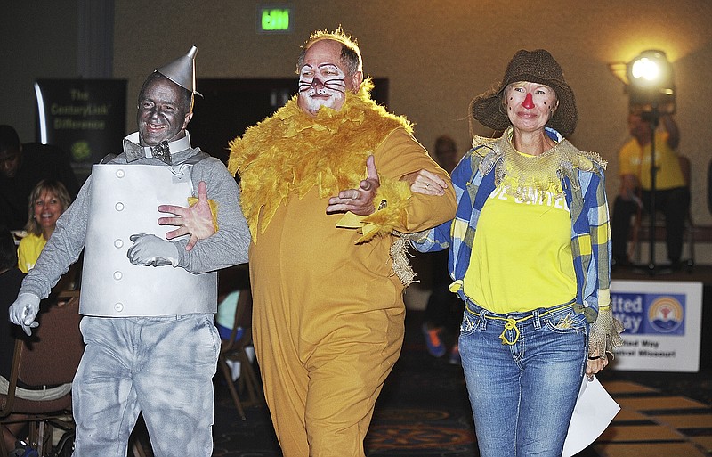 Following the theme of this year's United Way campaign, those who took to the stage were dressed as characters from "The Wizard of Oz." Mike Downey as tin man, Greg Gaffke as the cowardly lion and this year's chairman of the board, Gaye Suggett as the scarecrow, entered the room to applause and laughter as they skipped on the yellow brick road.