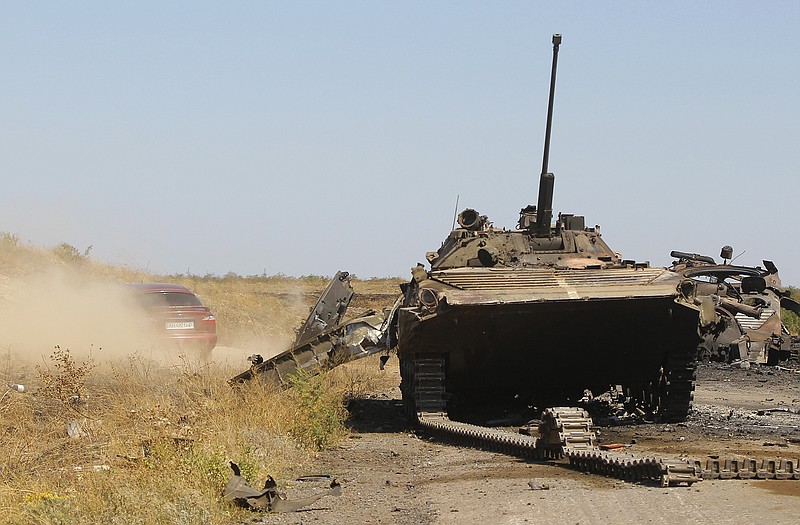 A column of destroyed Ukrainian military vehicles remain near the village of Novokaterynivka, eastern Ukraine, on Tuesday. 