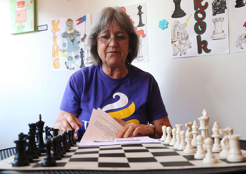 Ana Ravelo teaches chess at Lulu's Frozen Yogurt and Coffee Shop on Wednesday. She will hold classes again today and Friday. Ravelo hopes to bring more chess to the Fulton area.
