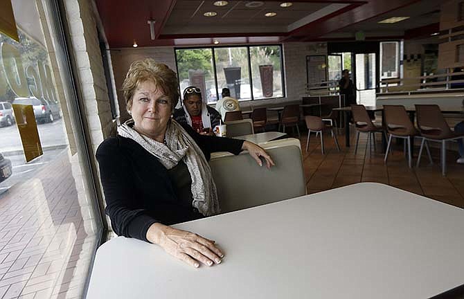 Kathryn Slater-Carter poses for photographs at a McDonald's restaurant she owns in Daly City, Calif., Tuesday, Sept. 2, 2014. Slater-Carter spearheaded a bill in California that could soon give franchisees greater protections in their dealings with franchisers. Around the country, union organizers are pushing to make McDonald's take responsibility for how workers are treated at its franchised restaurants.